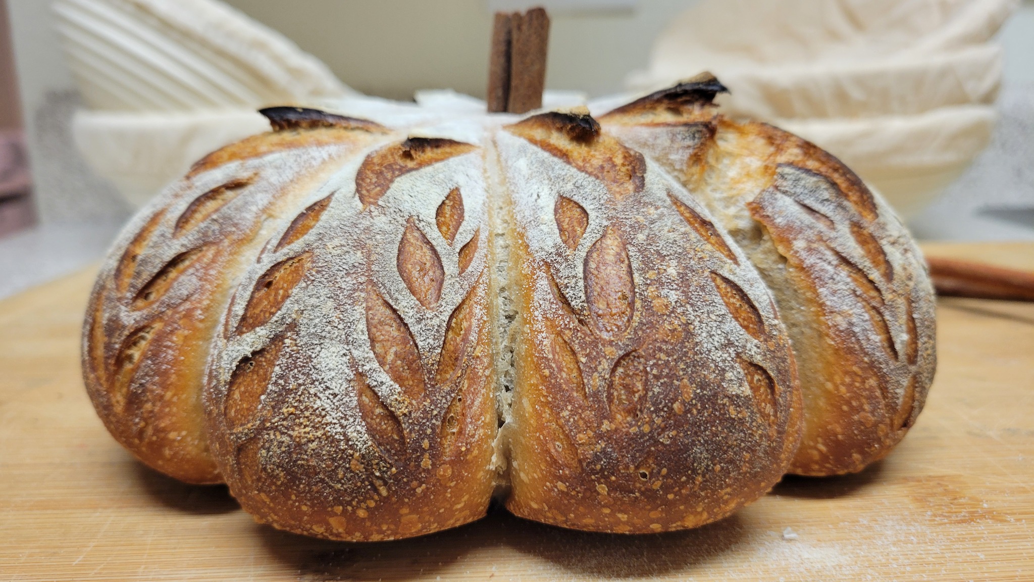 Pumpkin-shaped artisan sourdough bread with cinnamon stem